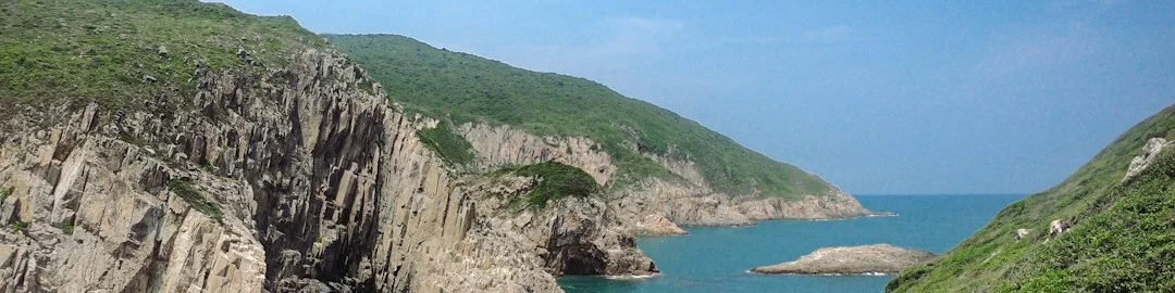 A view of a body of water from a hill